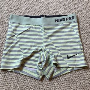 Yellow and gray striped Nike pro shorts